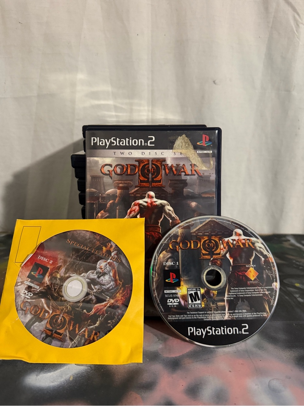 Sony PlayStation 2 God of War II Game Discs & Case - Black and Yellow Artwork